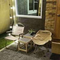 มุมนั่งเล่นหน้าบ้านจิ๋วกลางสวนที่สวนปันสุขสุโขทัย มุมนั่งเล่นหน้าบ้านจิ๋วกลางสวนที่สวนปันสุขสุโขทัย